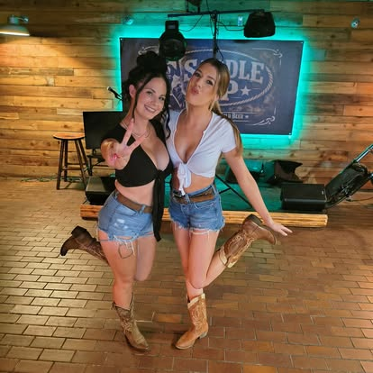 Guests posing on the Saddle Up stage