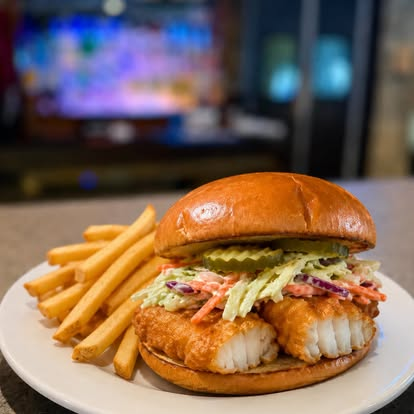 Crispy fish sandwich with fries
